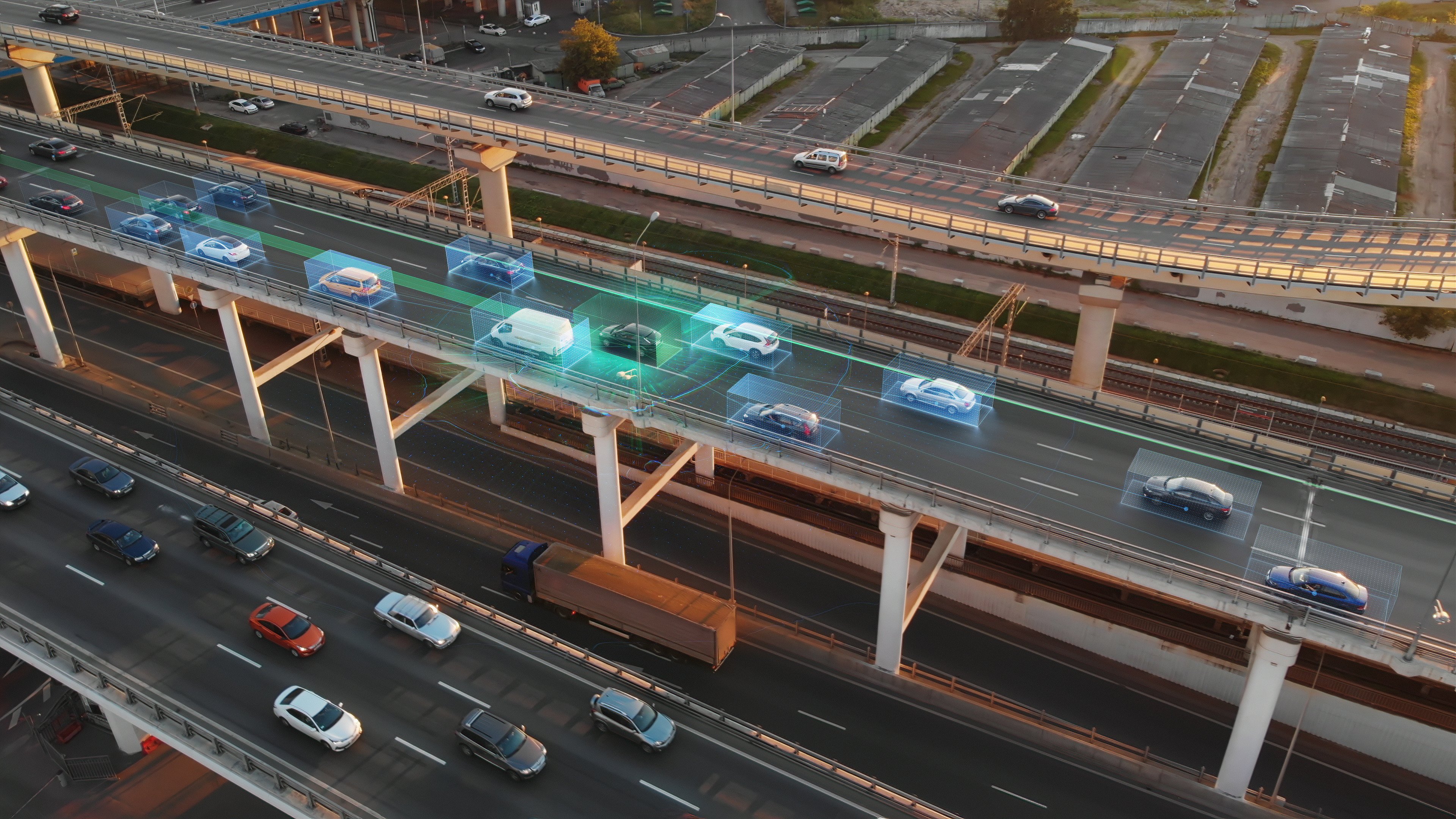 cars on a bridge, one is illuminated by bright blue light