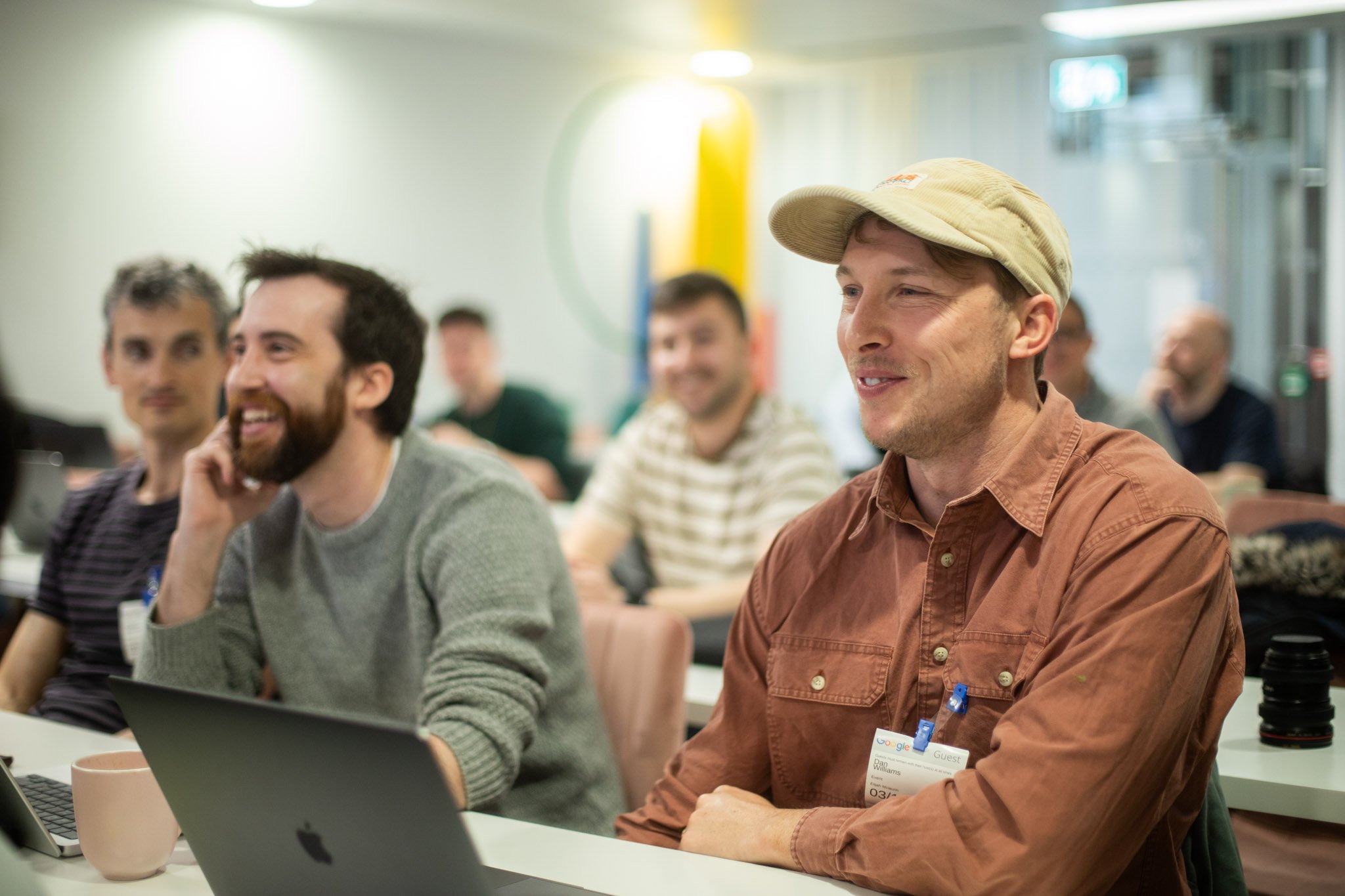 Happy INSHUR employees attending a company meeting